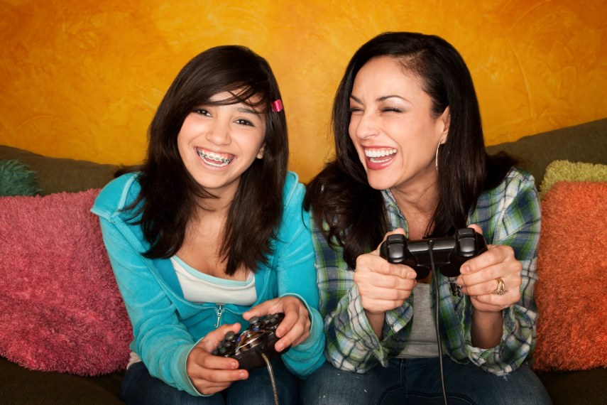 Girl With braces playing a game together.