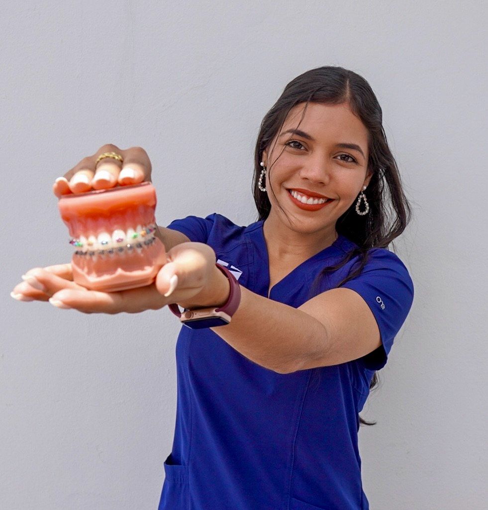 Team member with braces model